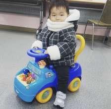 HyungJun enjoying his new toy car from Christmas