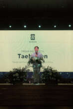 TaeHyeon speaking at the KKOOM Gala