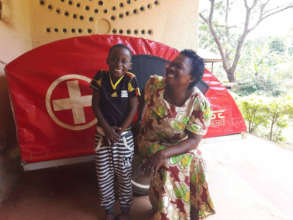 Margaret and her grandson play at the Birth House