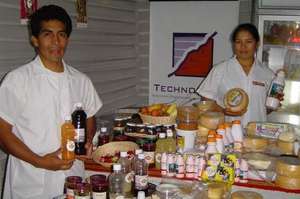 Workers pose with products