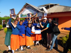 Students holding certificates after the training