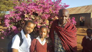 Debora -standing with parent whose child performed
