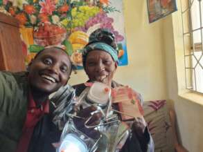 Grandma Behind the Solar Lantern in Gongali