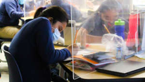 Masks and plexiglass are now standard in class