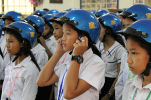 Students wear their new Safety Delivered helmets.