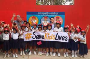 Students celebrate receiving their new helmets.