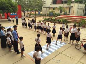 Students participate in a road safety simulation.