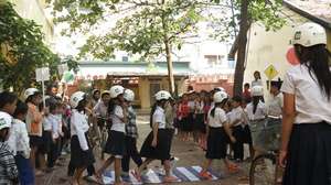 Students practice crossing the road safely