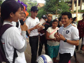 Students speak with the community on road safety.