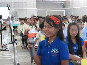 Students discuss passenger helmets in Cambodia
