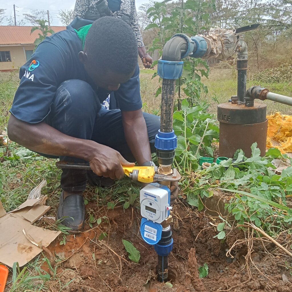 A Water Engineer connecting the Bulk Smart Meter