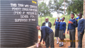 student drawing drinking water from new tank