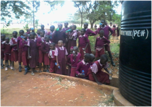 Children queue to draw water from water tank