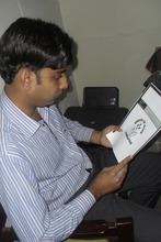 VP reviewing a Medical Booklet in the SOHF Office