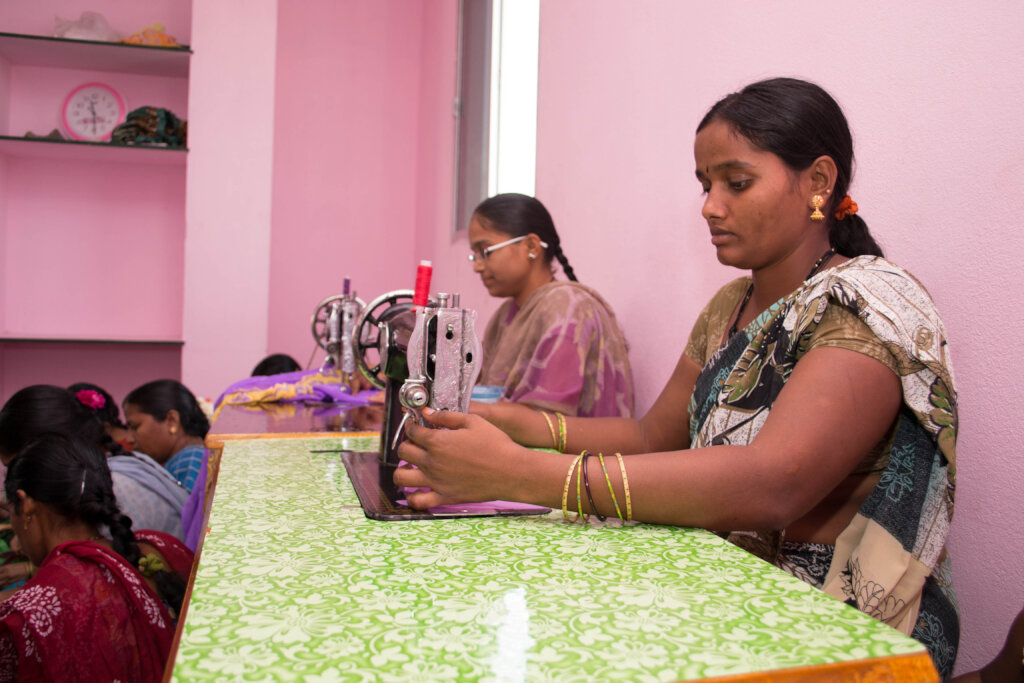 Poor Woman learning fashion designing skills india