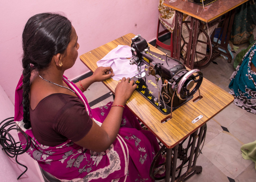 Poor woman learning tailoring training for income