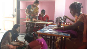 Poor women girls getting sewing machine donations