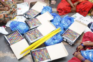 Provide sewing kits to underprivileged women