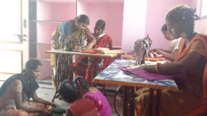 girls and women learning fashion designing skills
