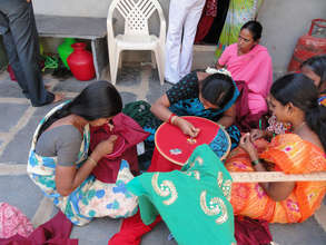 stiching designes on sarees by deprived women