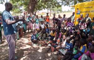 A group of schoolchildren around the BMP