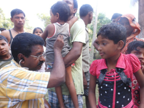 IMC doctor examining a child