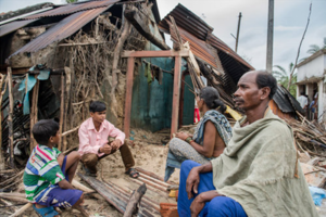 Basu Das and family with their destroyed home