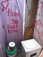 A message painted next to a household toilet