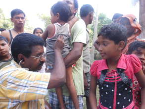 International Medical Corps doctor examining child