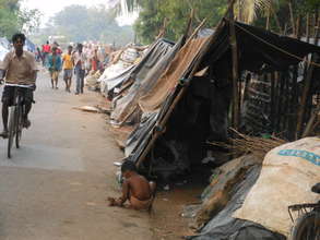 Displaced people in temporary road-side camps