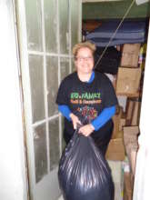 CARRYING CLOTHES FROM OUR WAREHOUSE TO FAMILIES