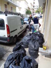 CARRYING CLOTHES TO OUR MINIVANS FOR DISTRIBUTIONS