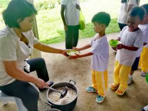 Waiting in line for soup served by teachers