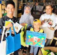 A young man happy to receive a new book