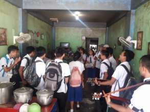 Caroling door to door to raise funds to travel