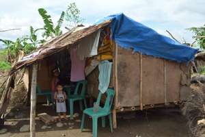 Malnourished child in makeshift shelter