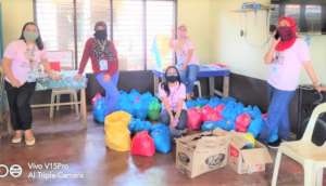 Volunteers arrange for supplies to be distributed
