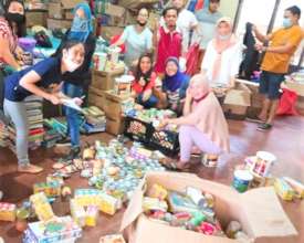 Teachers and volunteers pack relief supplies
