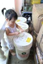 Young girl with AAI relief aid arriving