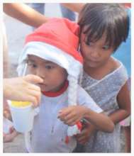 Child typhoon victims being fed