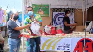 Volunteers giving rice and soap after flooding