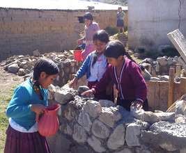 Girls helping in the construction of bathrooms