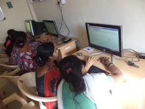 Rural girls learning ABC of computer