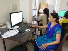 Asavari taking the computer exam with confidence