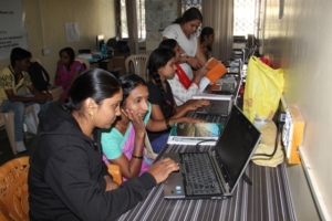 Women learning computers with enthusiasm