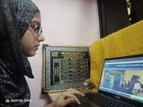Saira using a neighbor's laptop