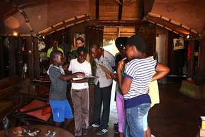 The children take a tour of a game lodge