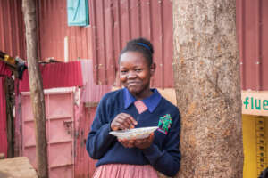 Natalia eating her favourite meal; rice and beans.