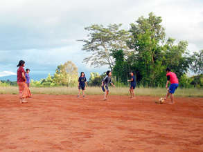Students play football together