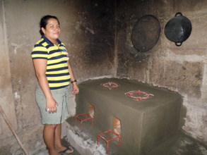 Elsa G. with her new Emelda improved cookstove